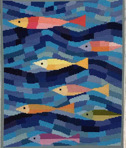 An artistic design of colorful sea fish in blue waves. This modern fish cross stitch pattern uses Anchor cotton colors for better shades of blue.